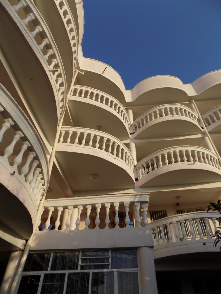 This photo shows the elaborate cream facade of our hotel in Alamata
